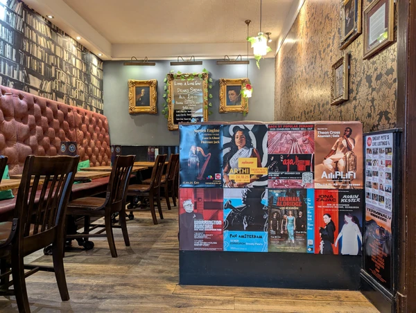 Posters on a wall in Edinburgh